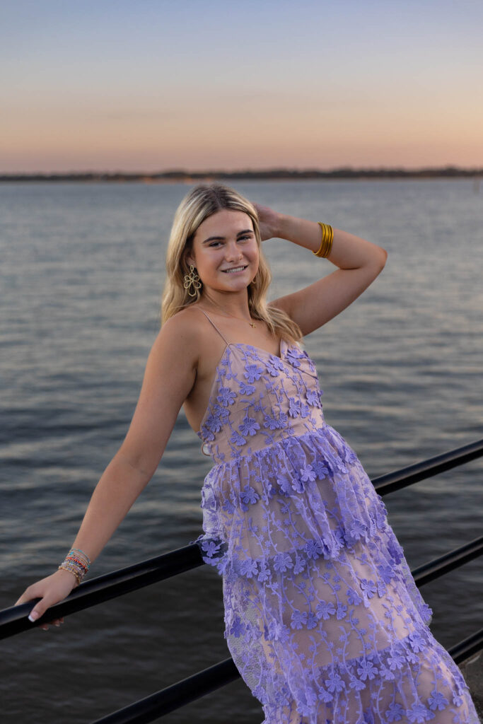 Senior girl posing at sunset by the water, captured during a booked summer senior pictures session – Megan Bowers Photography
