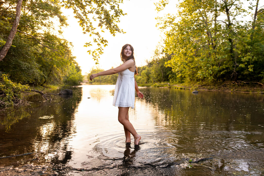 Senior who felt awkward in front of the camera laughing during a fully guided Lawrence KS senior session