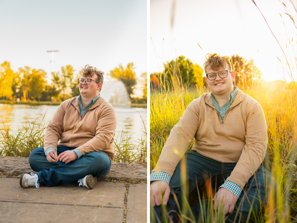 High school senior sitting by the water and in tall prairie grass at golden hour at the Lawrence Arboretum