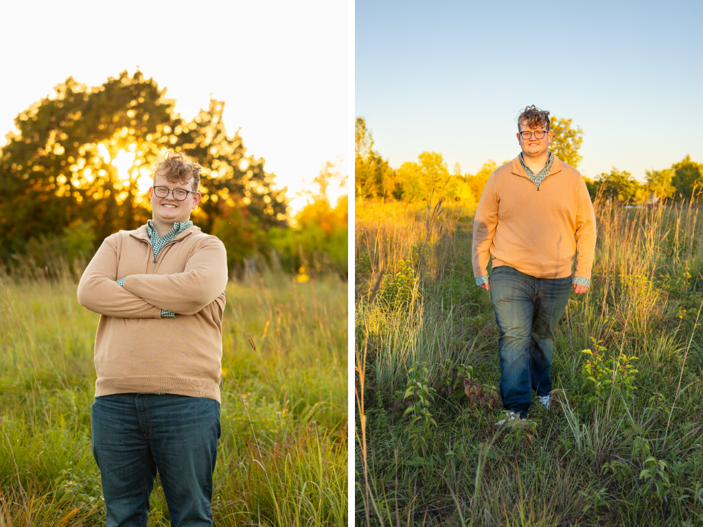 Senior in a tan quarter-zip standing with arms crossed and in a prairie field at golden hour at the Lawrence Arboretum