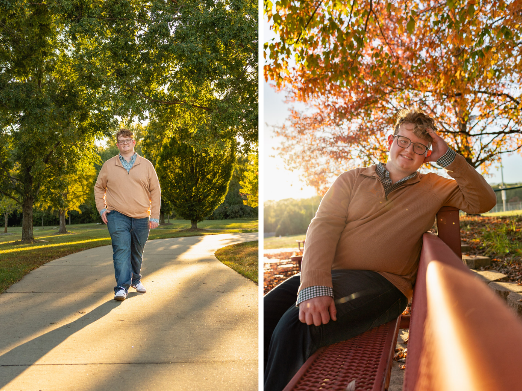 High school senior walking a tree-lined path and sitting on a red bench under orange fall leaves at the Lawrence Arboretum