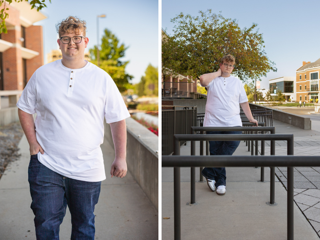 High school senior in a white henley walking and leaning on railings on the KU campus in Lawrence, Kansas