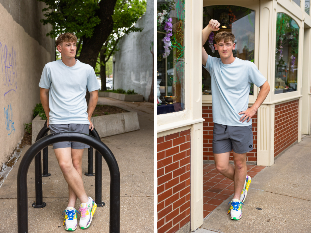 Senior boy leaning on a bike rack and a downtown storefront along a Lawrence sidewalk.