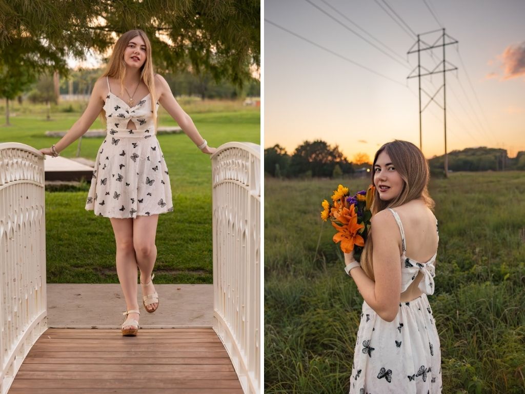 Lily standing on a white footbridge in a butterfly dress, and holding flowers in a grassy field at sunset